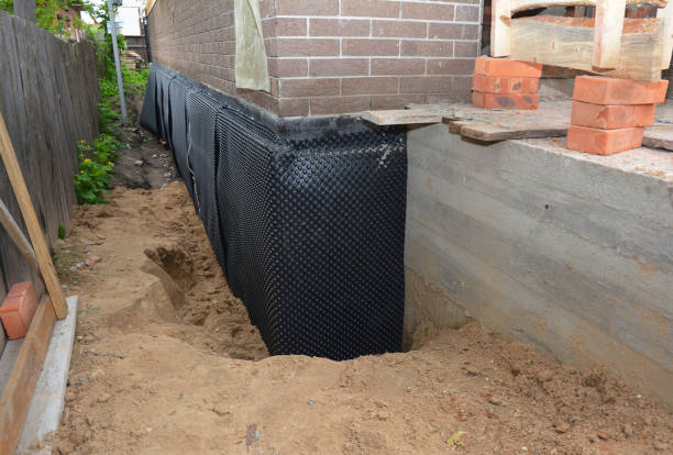 Happy homeowners after waterproofing job in Point Pleasant Beach